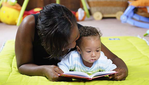 Mom reading to baby