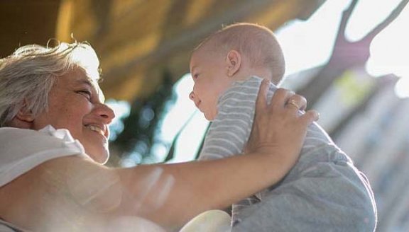 grandmother and her grandson are enjoying outdoor beautiful day