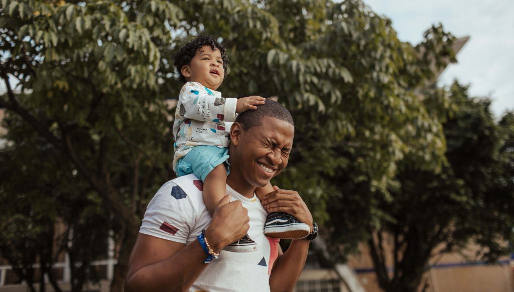 DAD Carrying Baby On Shoulders