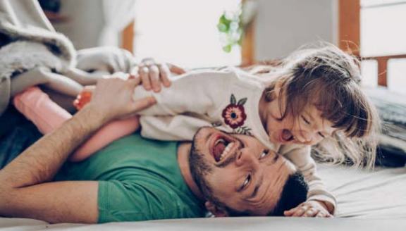 Father playing with his daughter